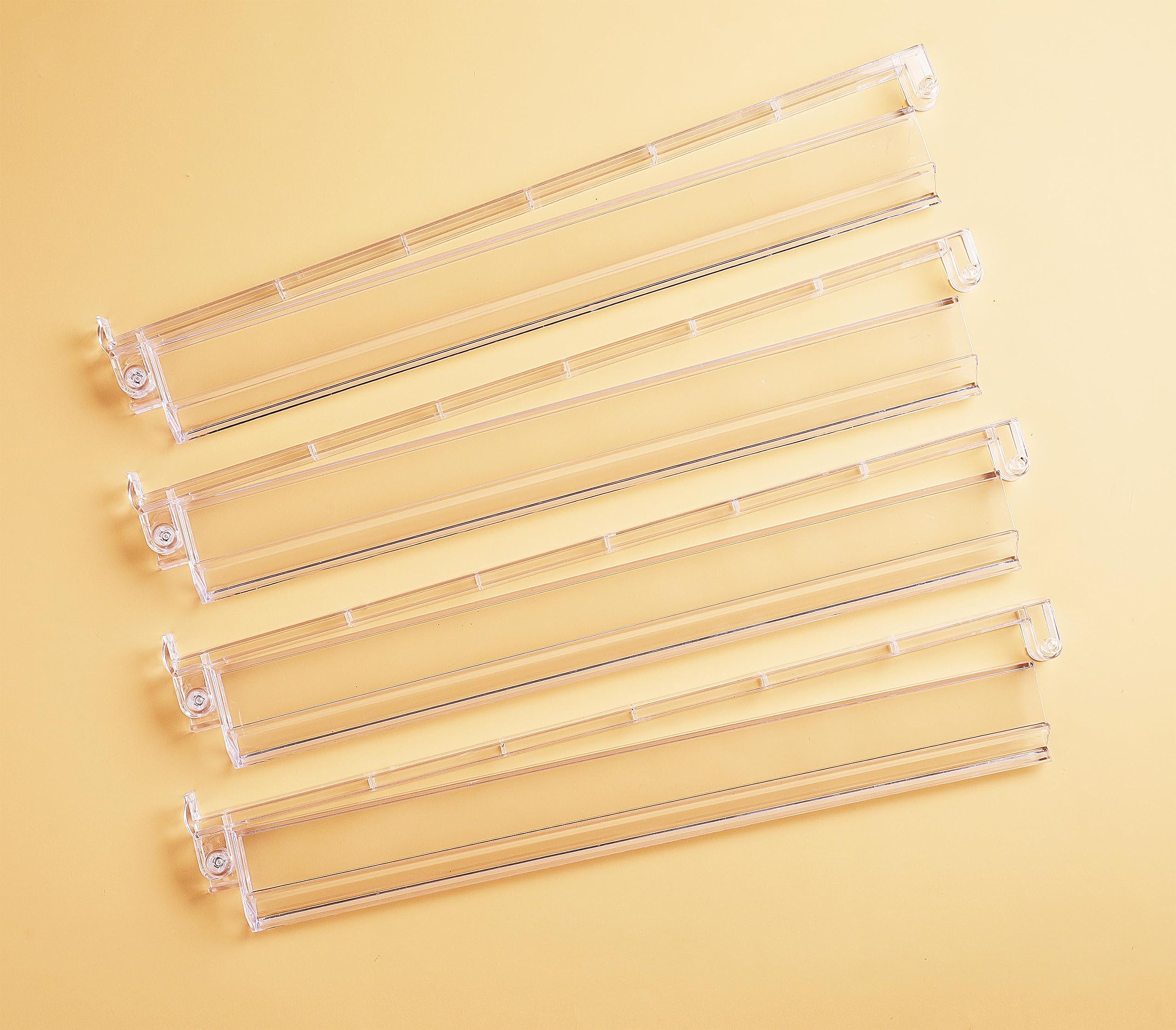 Four clear acrylic Mahjong racks with integrated pushers