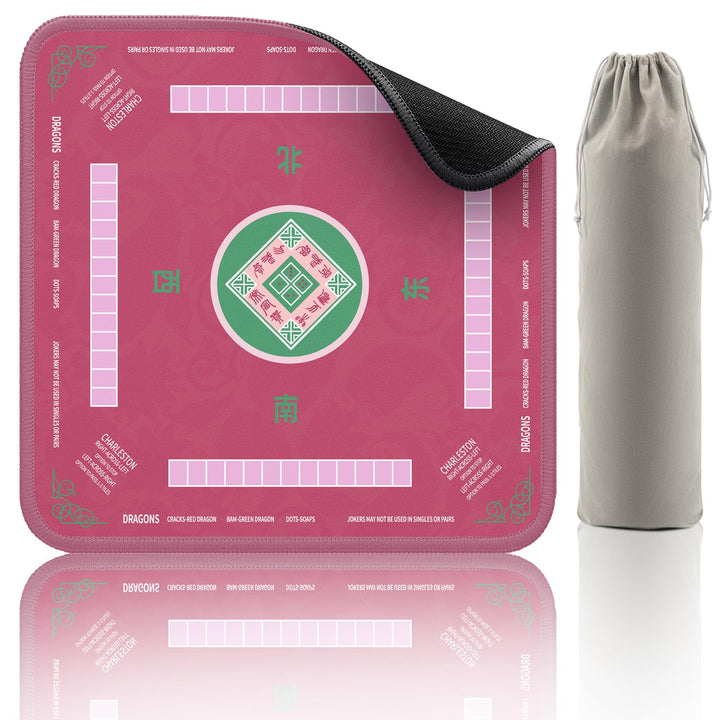 Pink 32.4-inch Mahjong mat with black textured underside beside a gray drawstring pouch