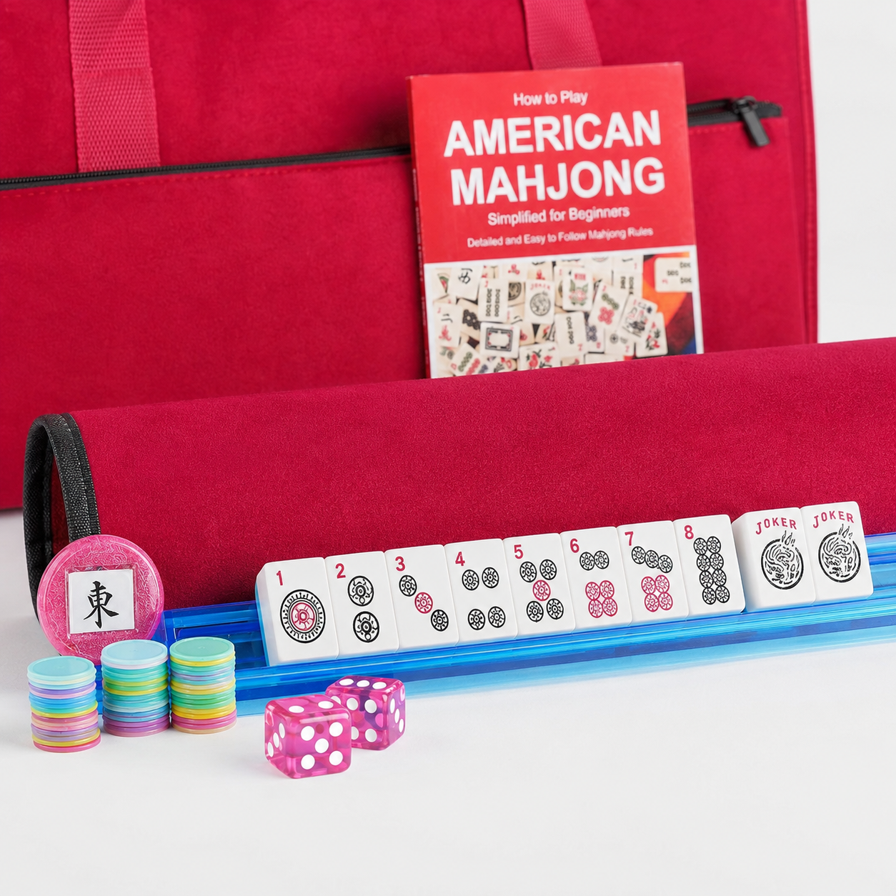Close-up of red Mahjong case, blue rack-pusher, dice, chips and white tiles