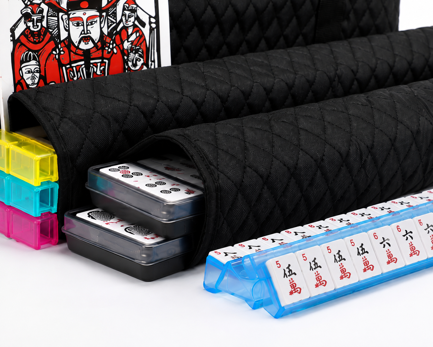 Close-up of black quilted Mahjong set with tile trays and blue rack-pusher